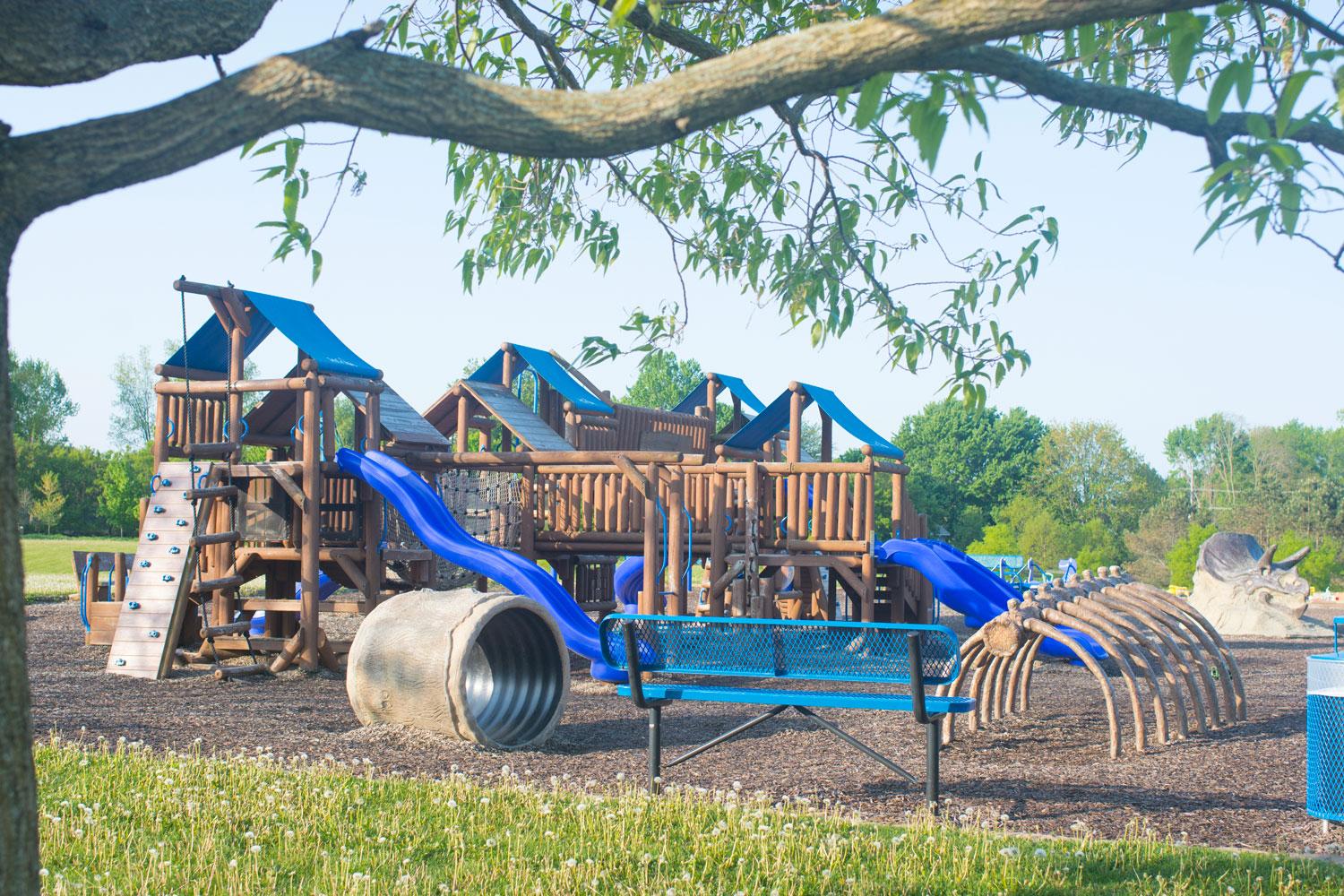 Playground: Large wooden playground with blue canopies and slides