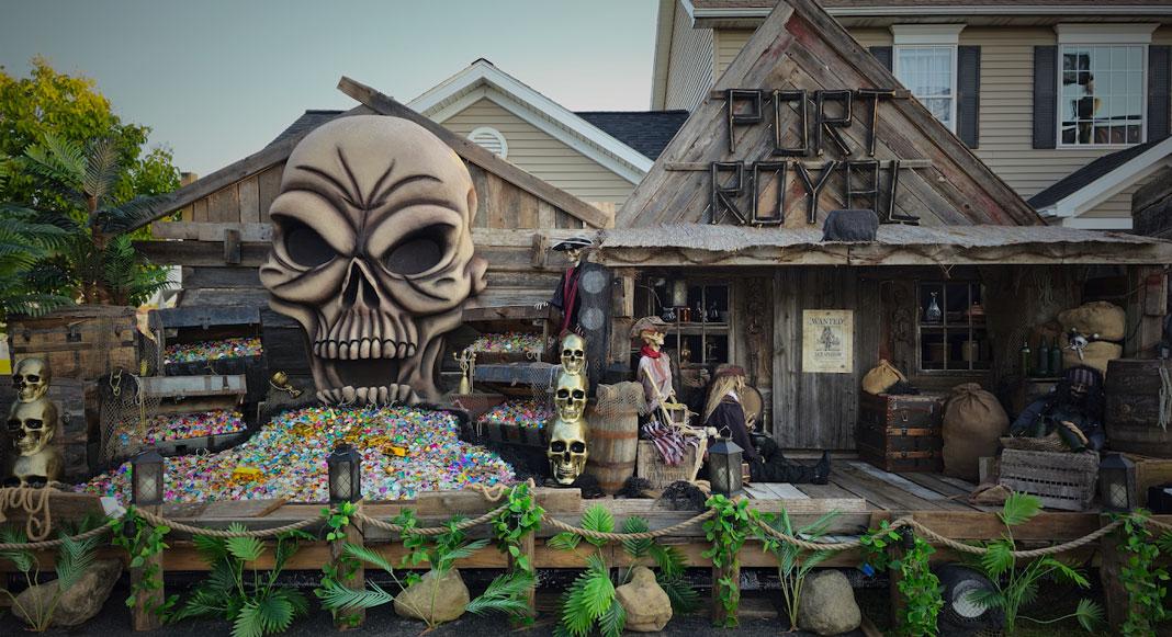 Skeletons and pirates decorate a dock outside a home.