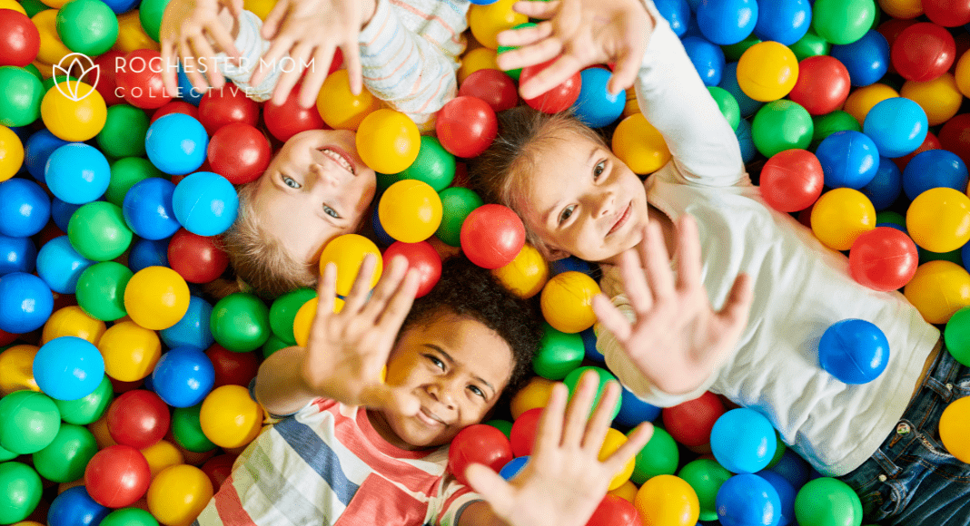 Kids play in a ball pit.