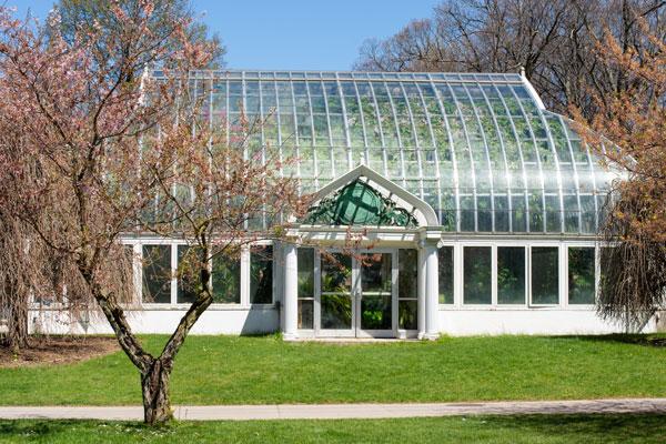 A conservatory building with glass roof.