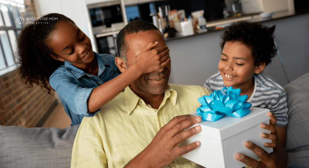 Two kids surprise their dad with a present.